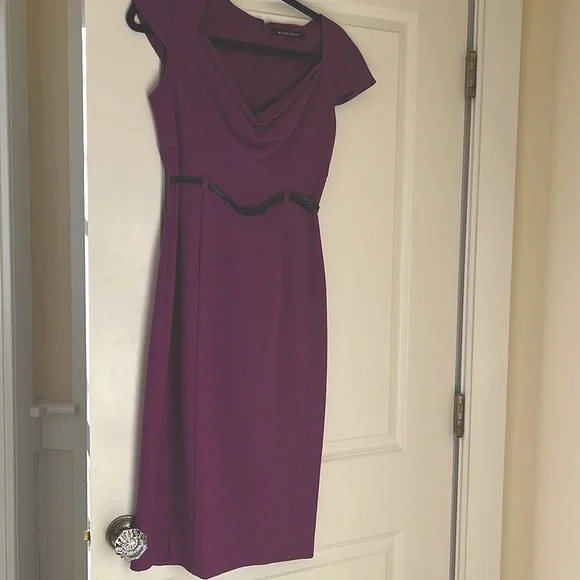 Rich purple dress with leather belt form fitted and fully lined.